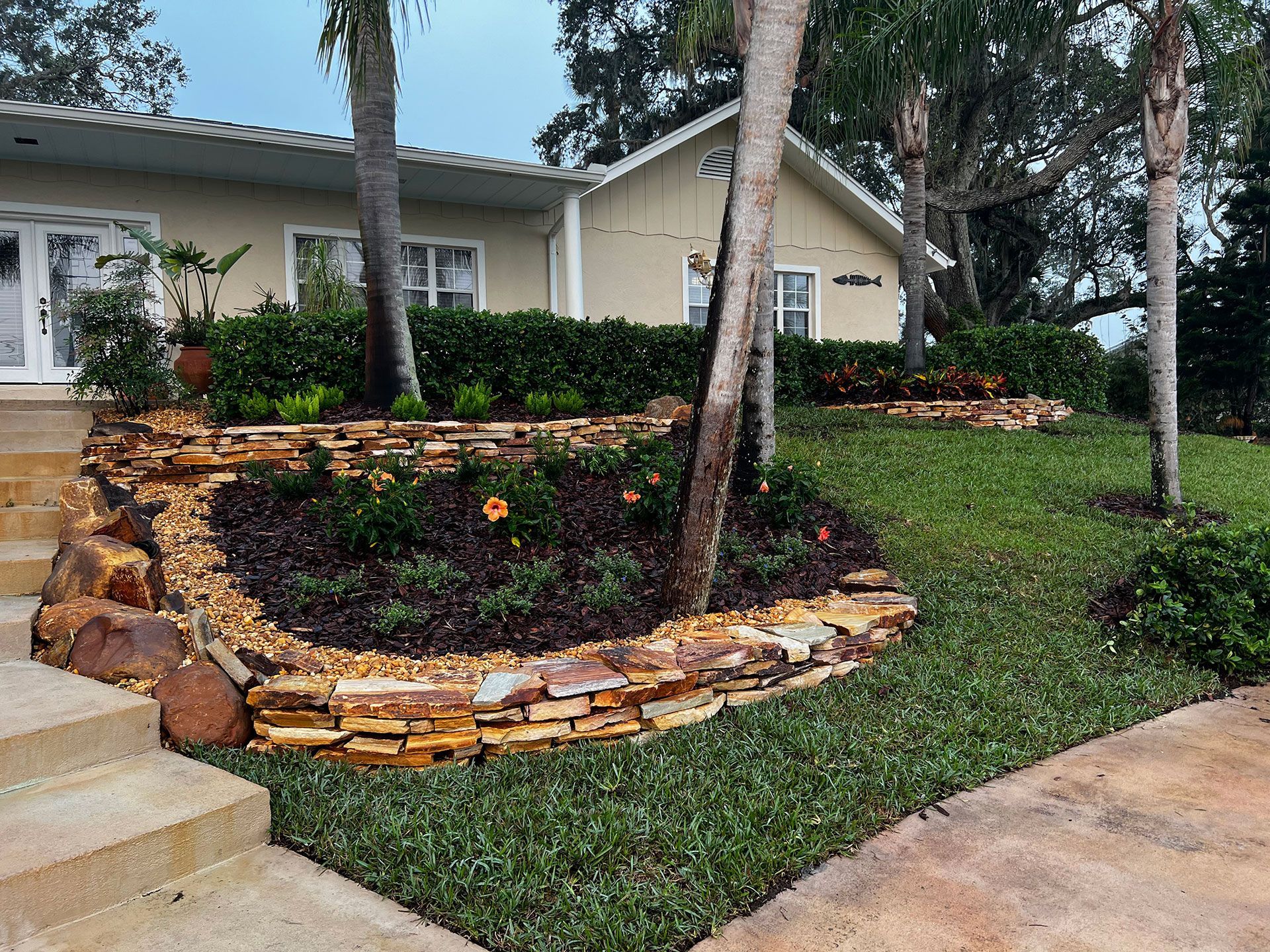 flowerbed surrounded with stone and rocks