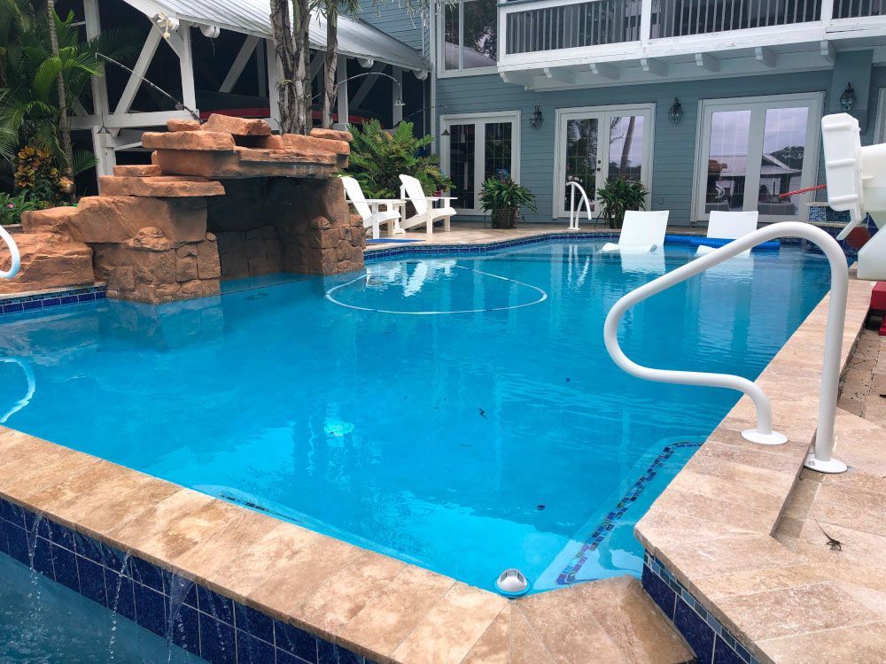 swimming pool with rock waterfall feature