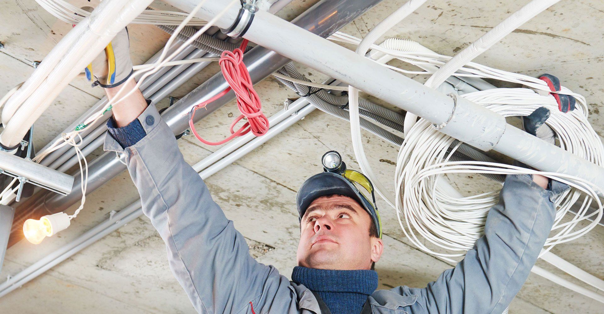 Line electrician builder engineer worker at indoor construction site