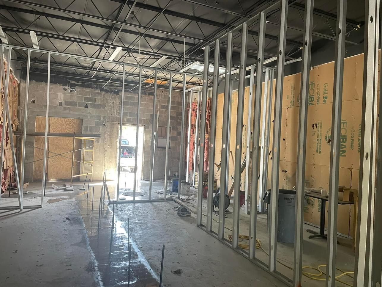 The inside of a building under construction with a lot of metal frames.