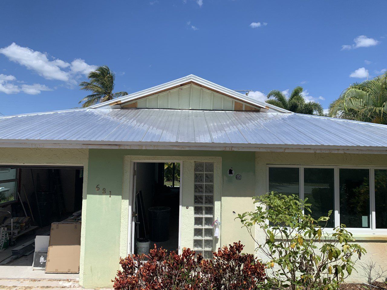 A house with a metal roof is being remodeled.