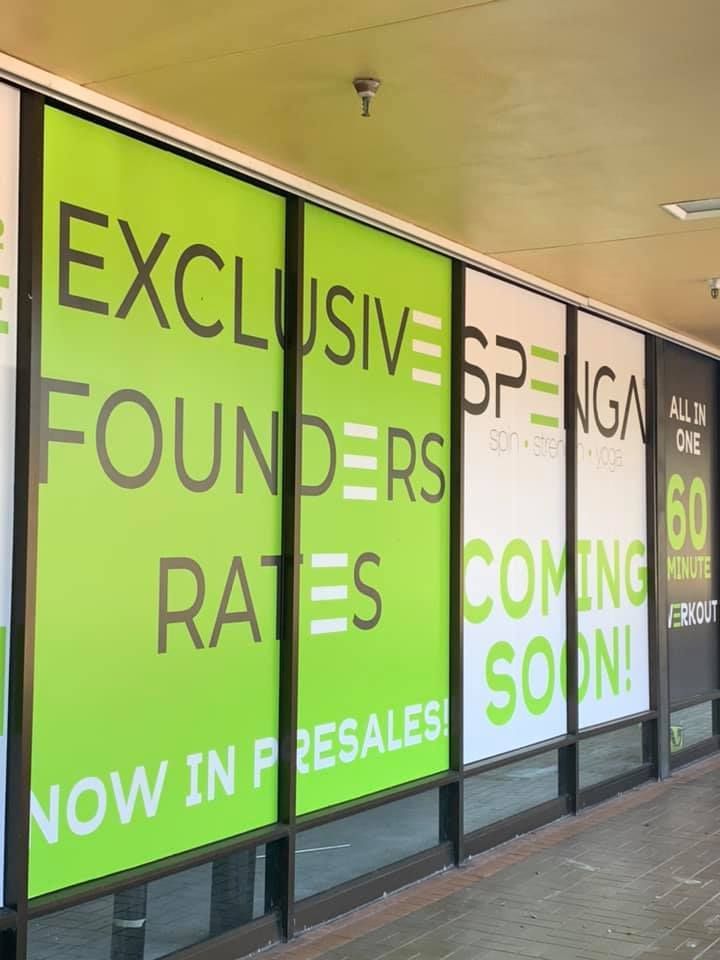A green and white sign that says exclusive founders rates coming soon