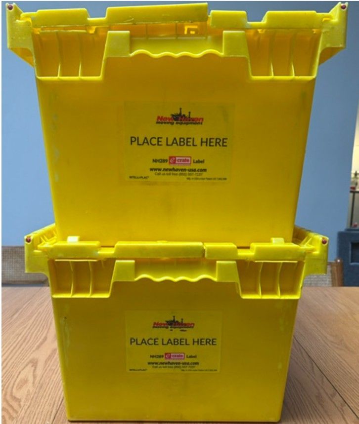 Two stacked yellow plastic storage bins with 