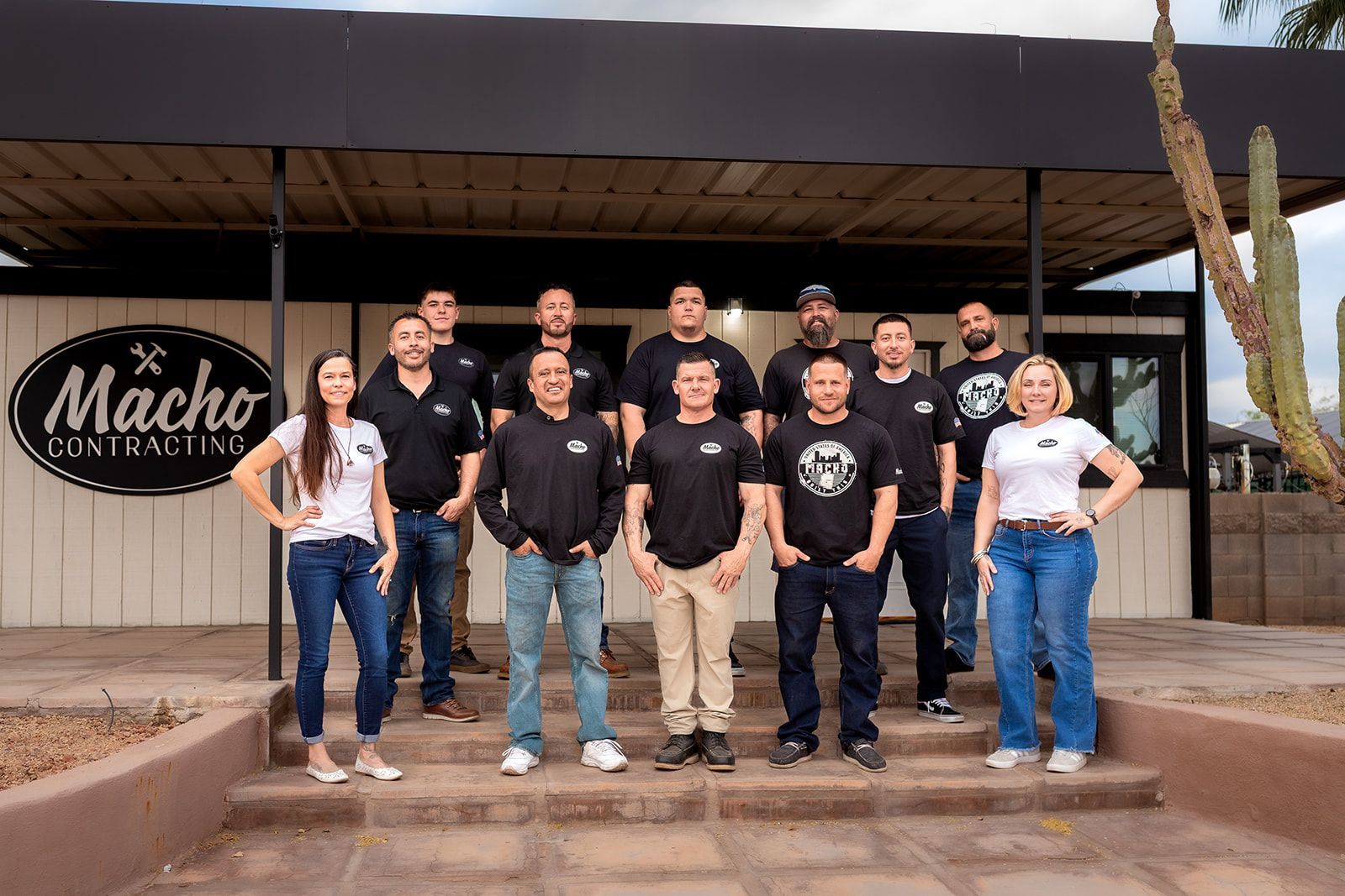 Group of people in front of a building with