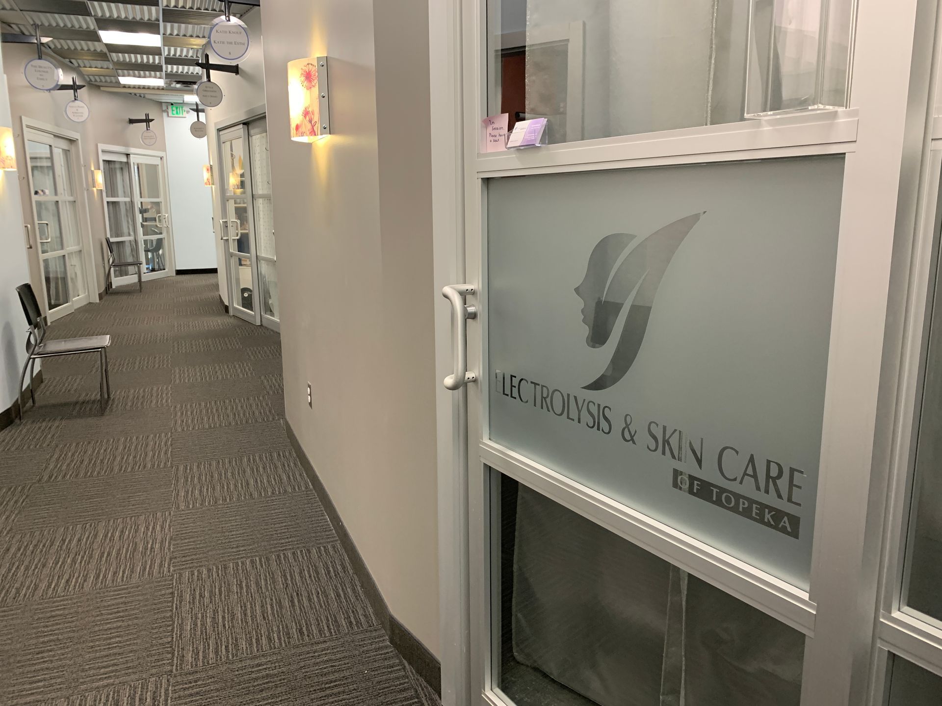 image of hallway with multiple doors. With a focus on the door to Electrolysis & skin care of Topeka