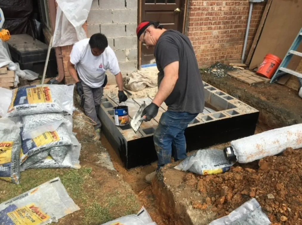 men working on exterior symmetry elevator