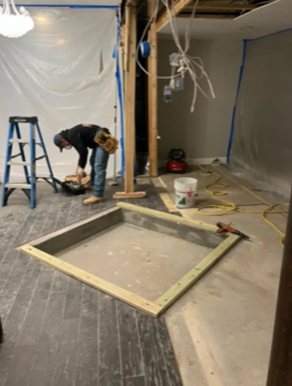 man working on interior symmetry elevator