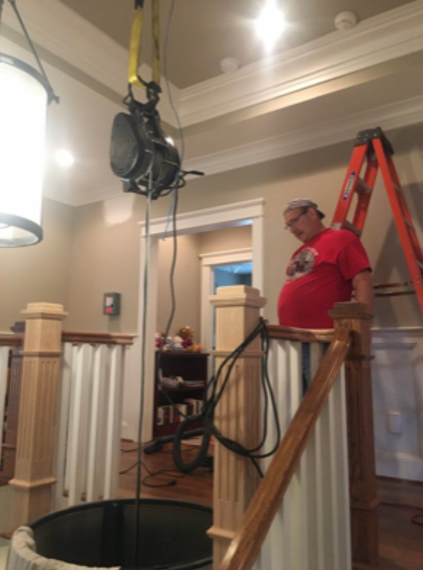 man working on Pneumatic Vacuum Elevator