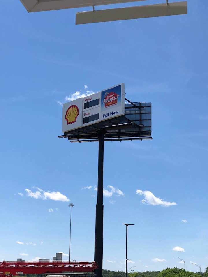 a billboard with a shell logo on it