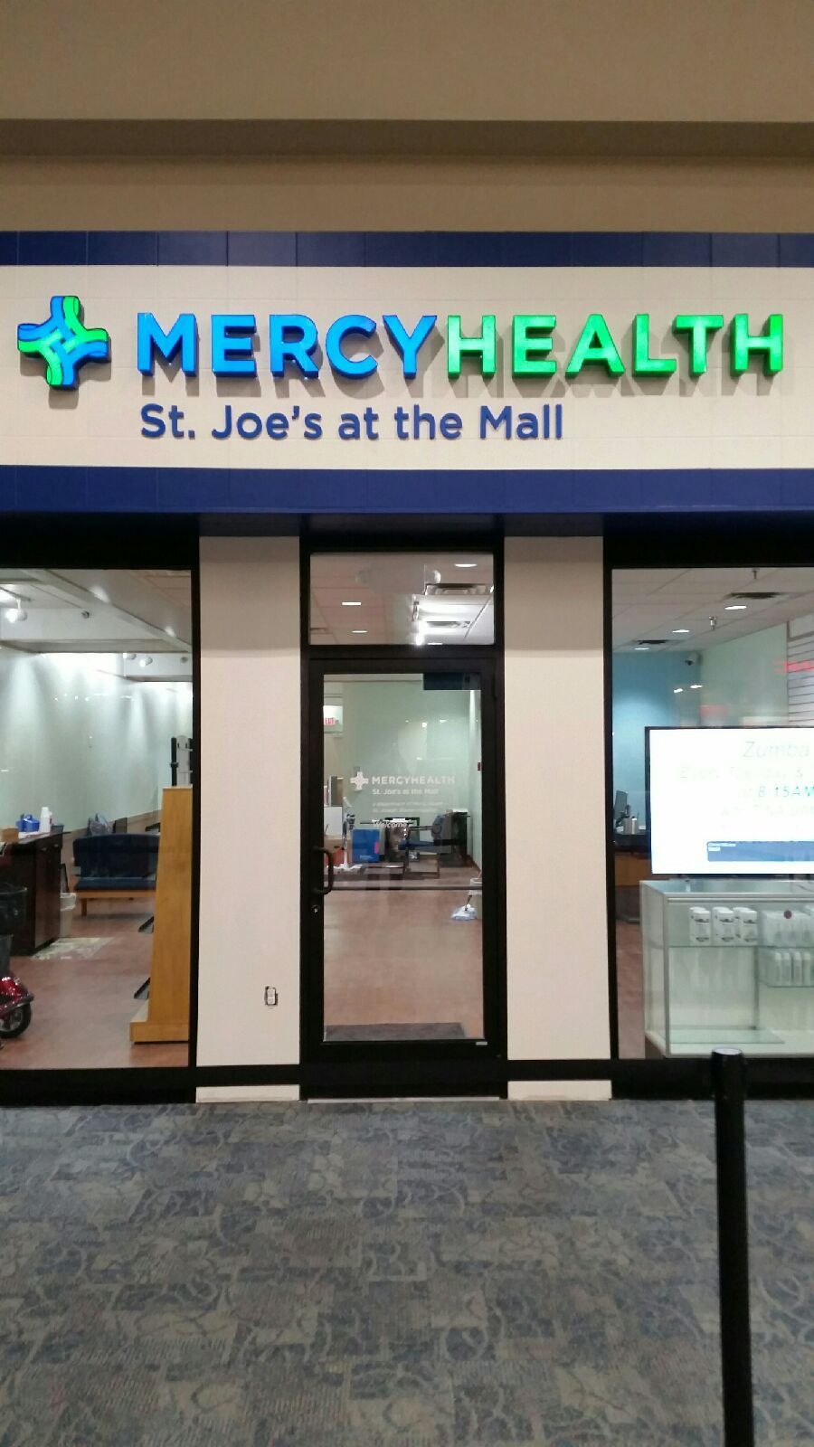 the front of a mercy health store in a mall