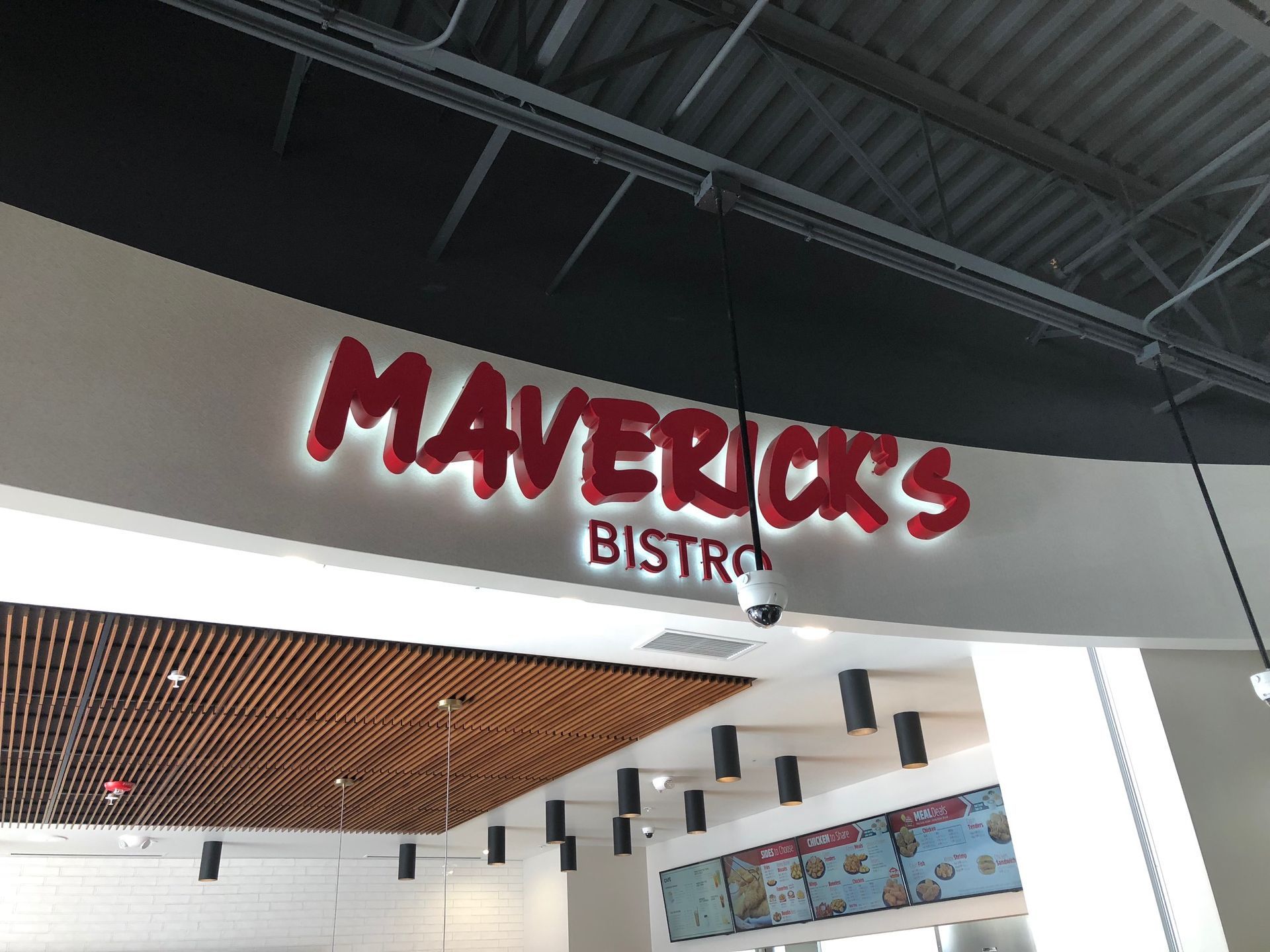 a restaurant with a sign that says maverick 's bistro
