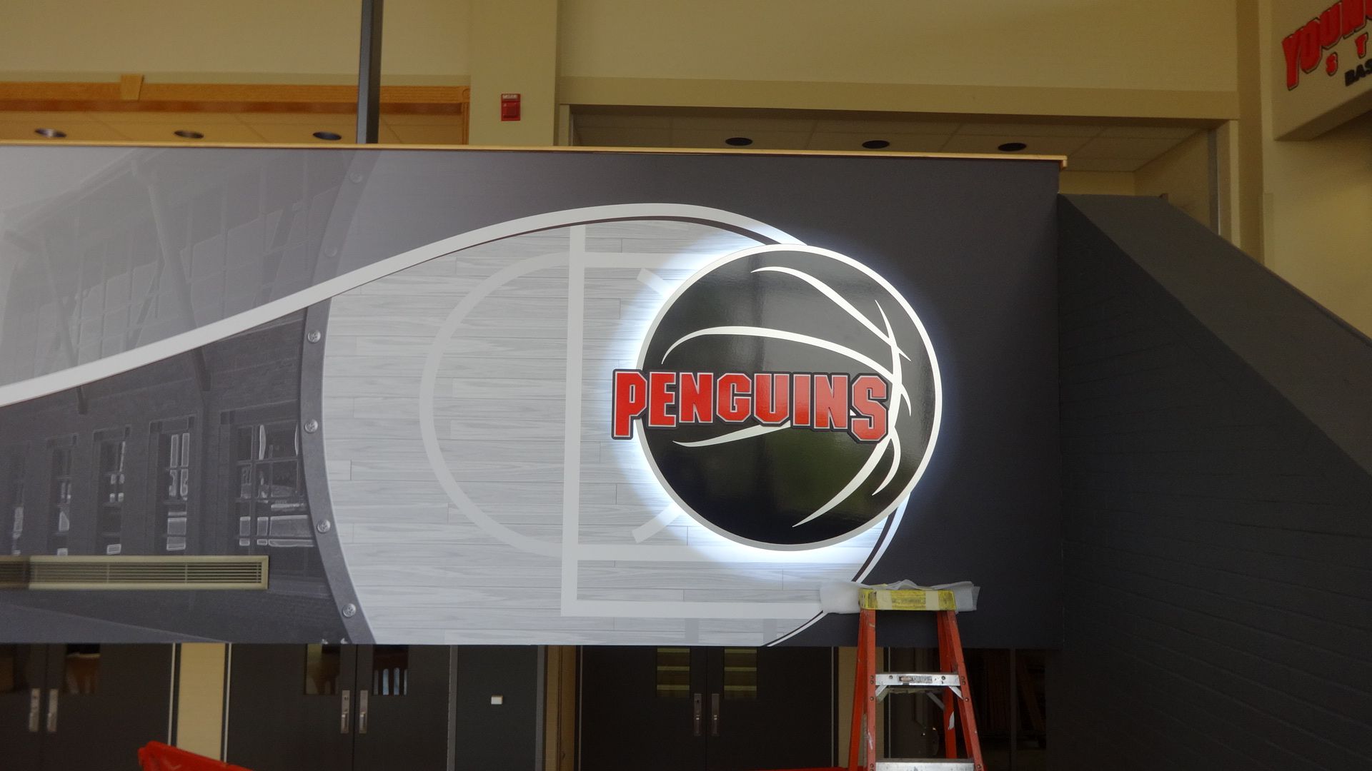 a basketball with the word penguins on it