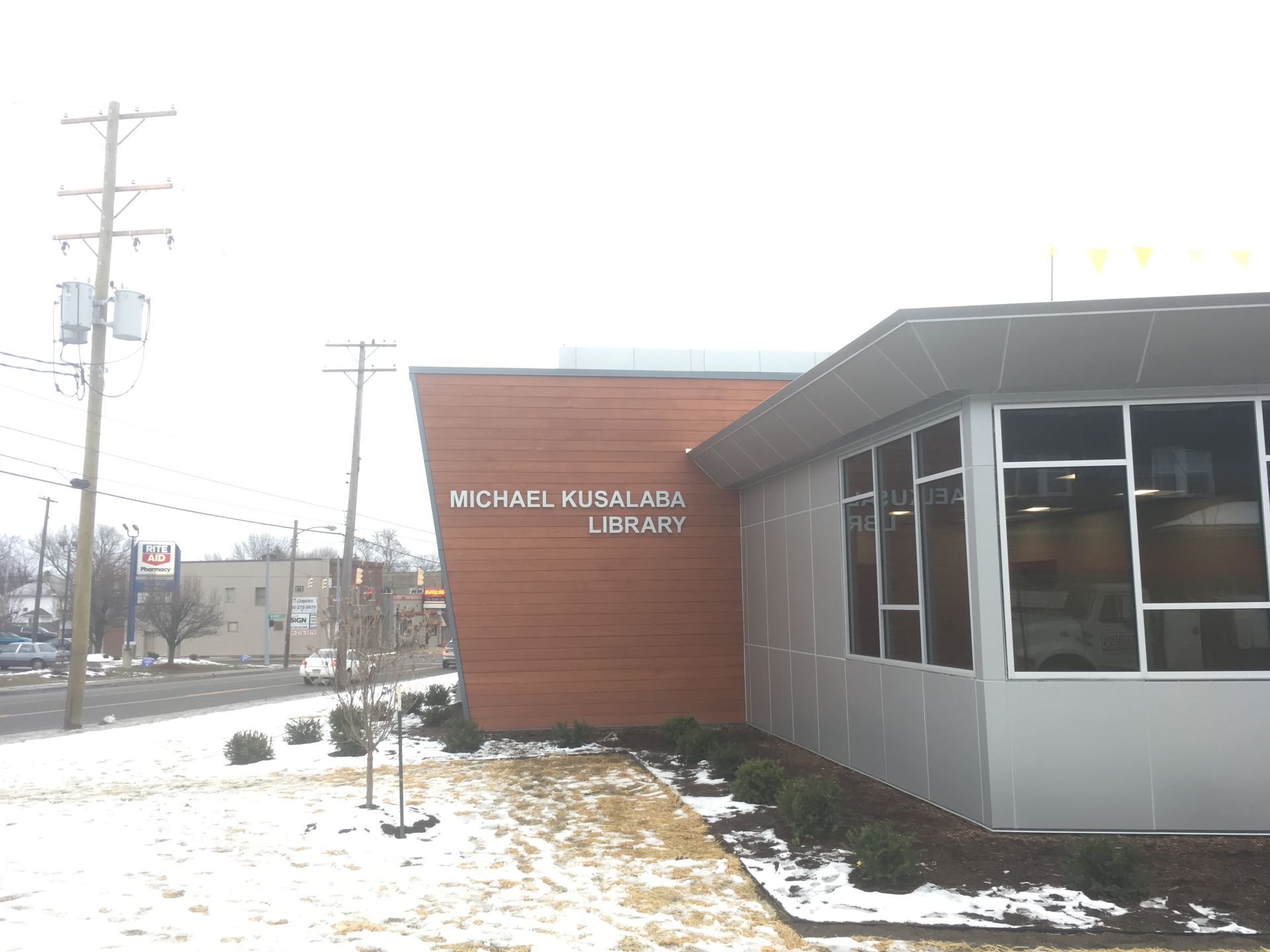 a large building with a lot of windows is covered in snow 