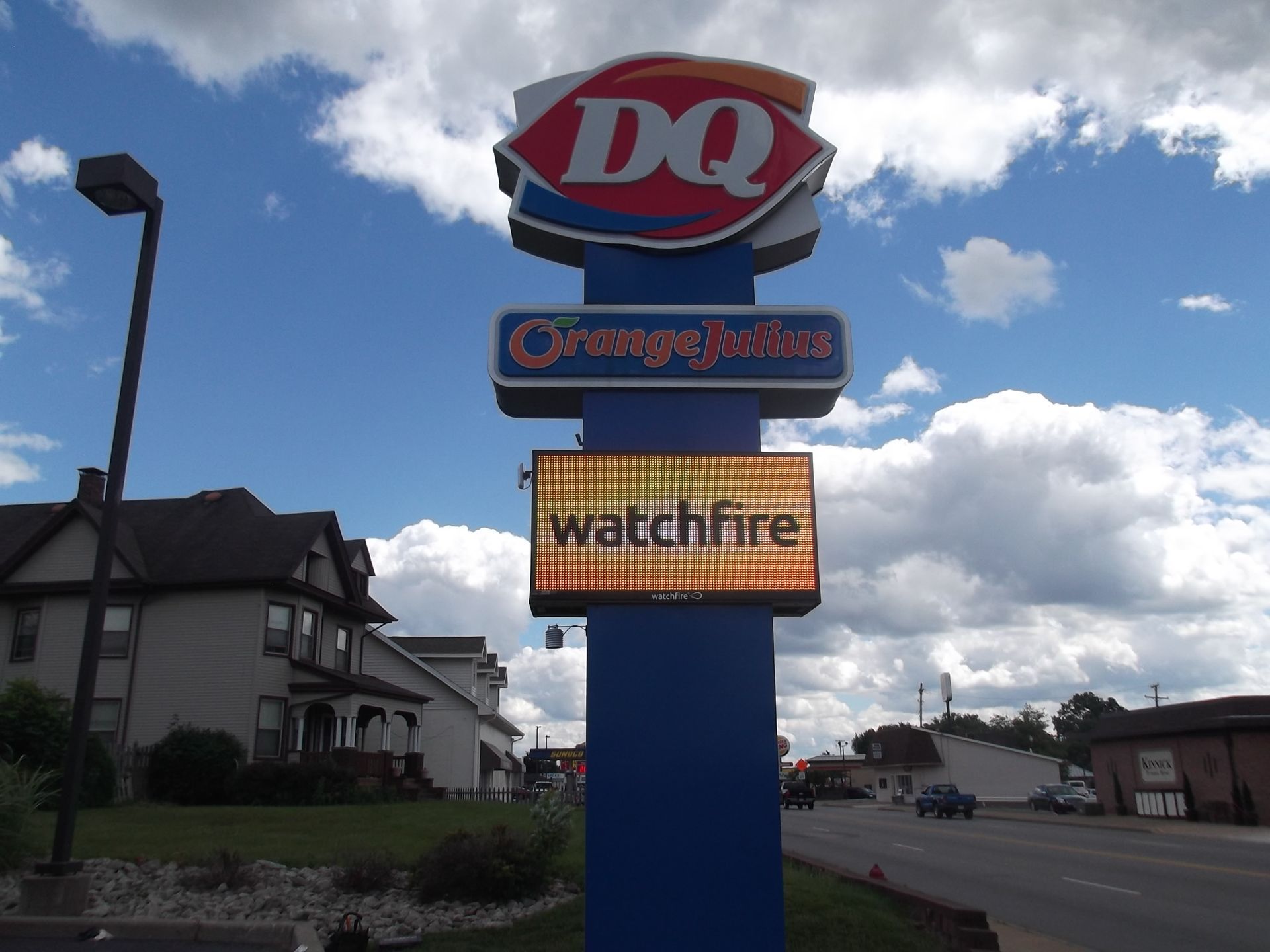 a sign for dq orange juice and watchfire