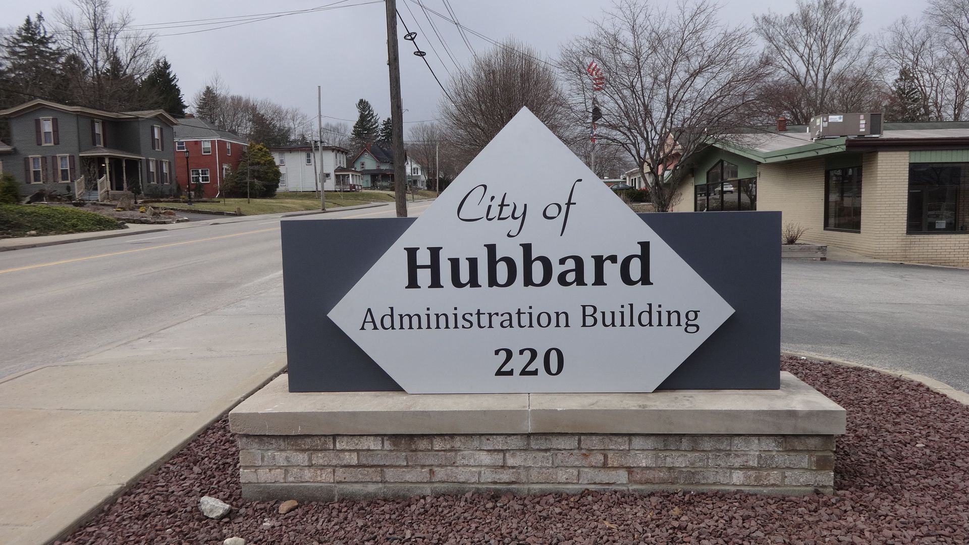 a sign for the city of hubbard administration building 220