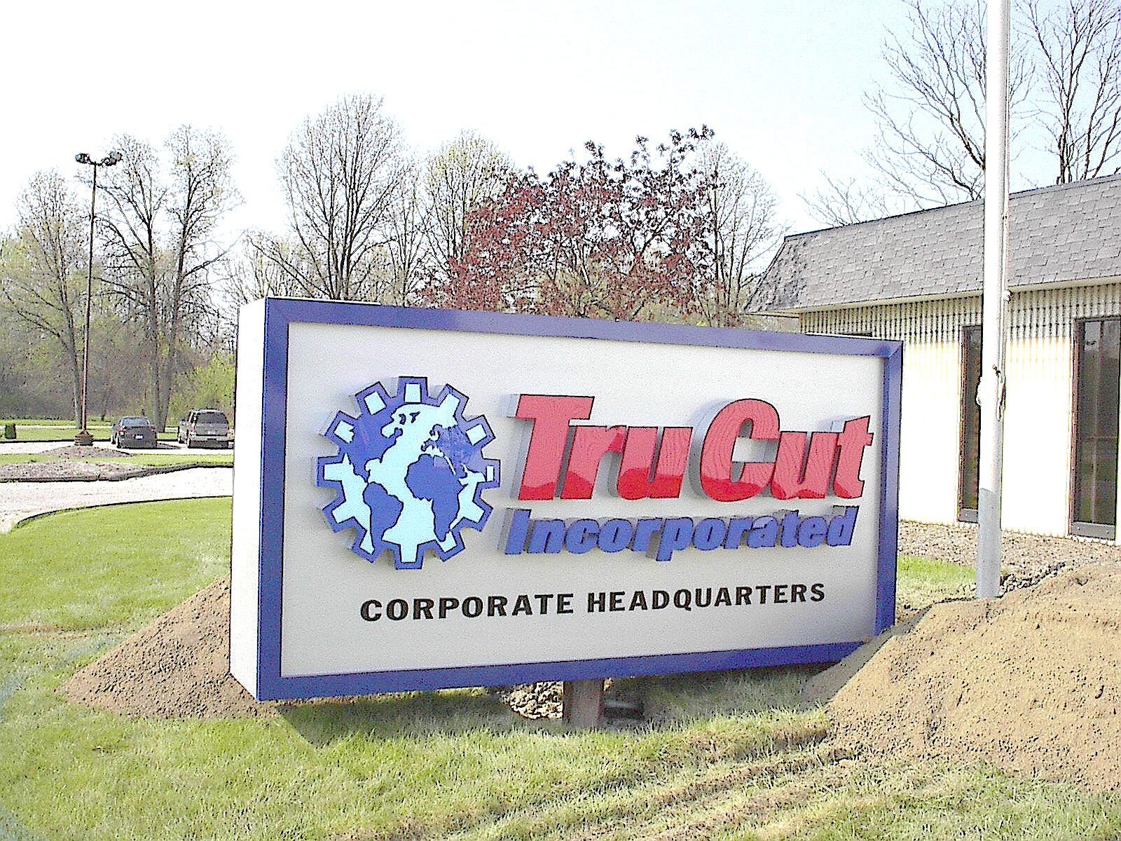 a tru cut corporate headquarters sign in front of a building