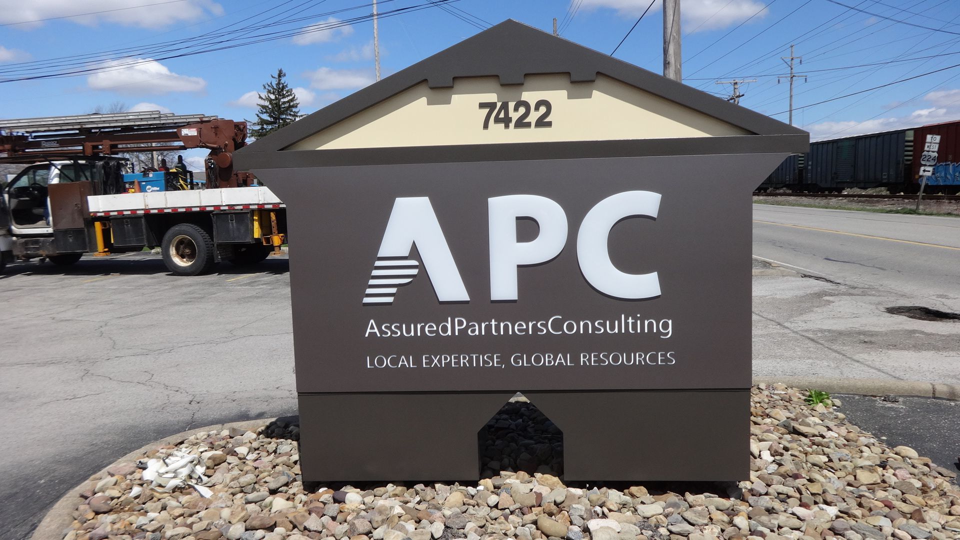 a sign that says apc on it in front of a truck