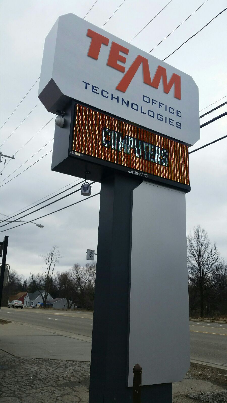 a sign that says team office technologies on it