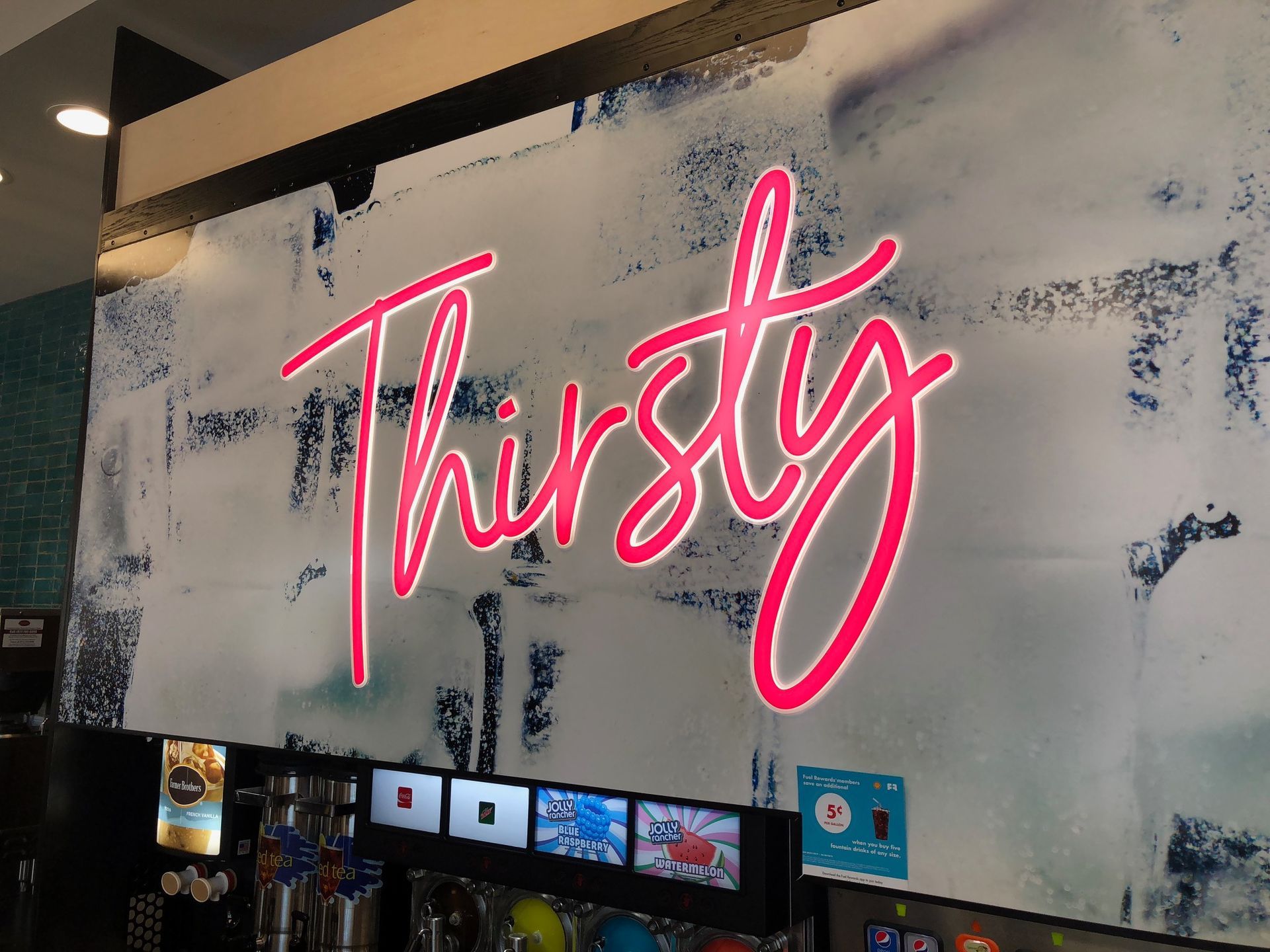 pink cursive led thirsty sign