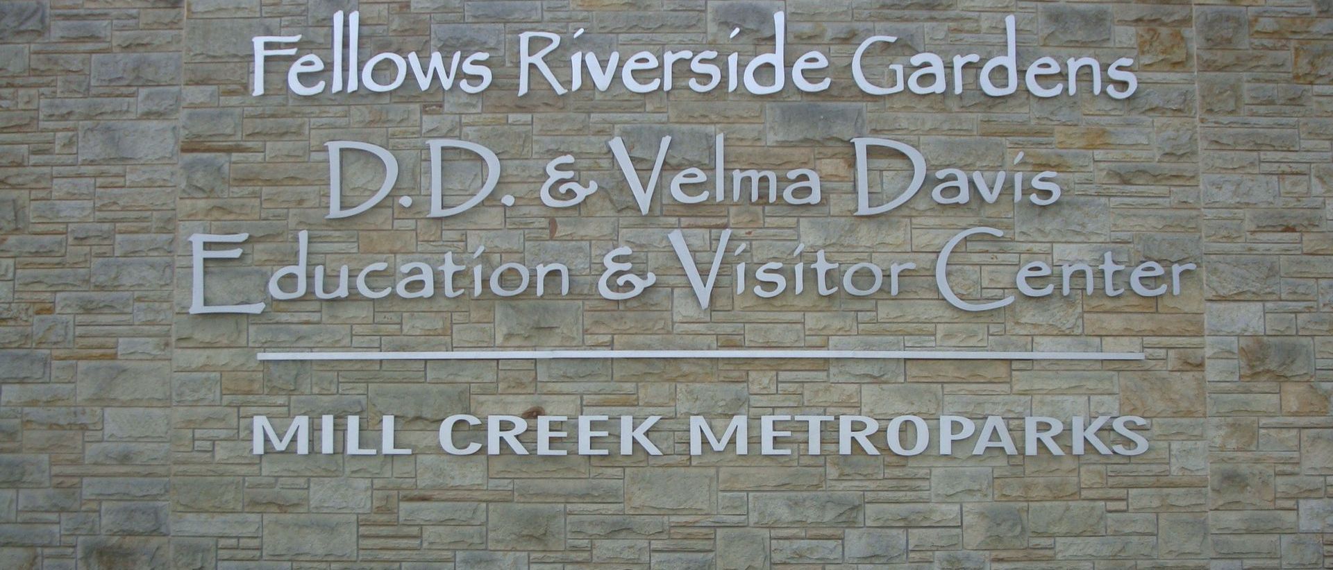White channel letter signs on tan brick building 