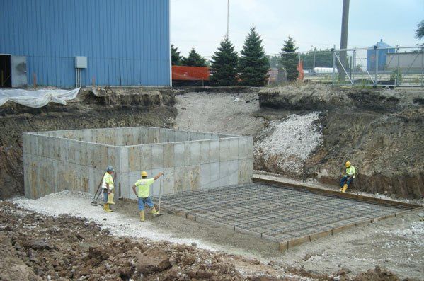 construction workers on building foundation
