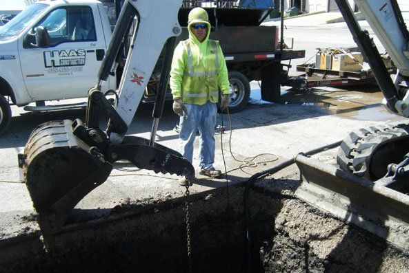 man working with backhoe
