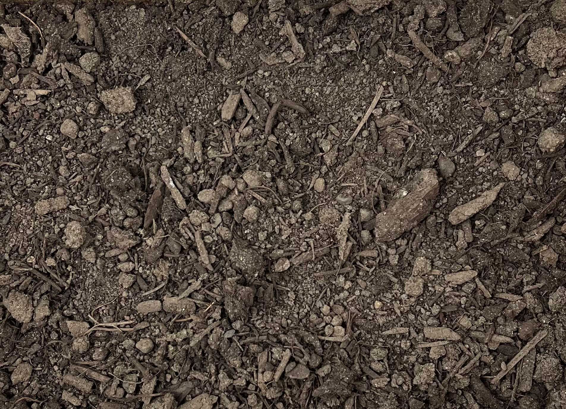 A close up of a pile of dirt and rocks.