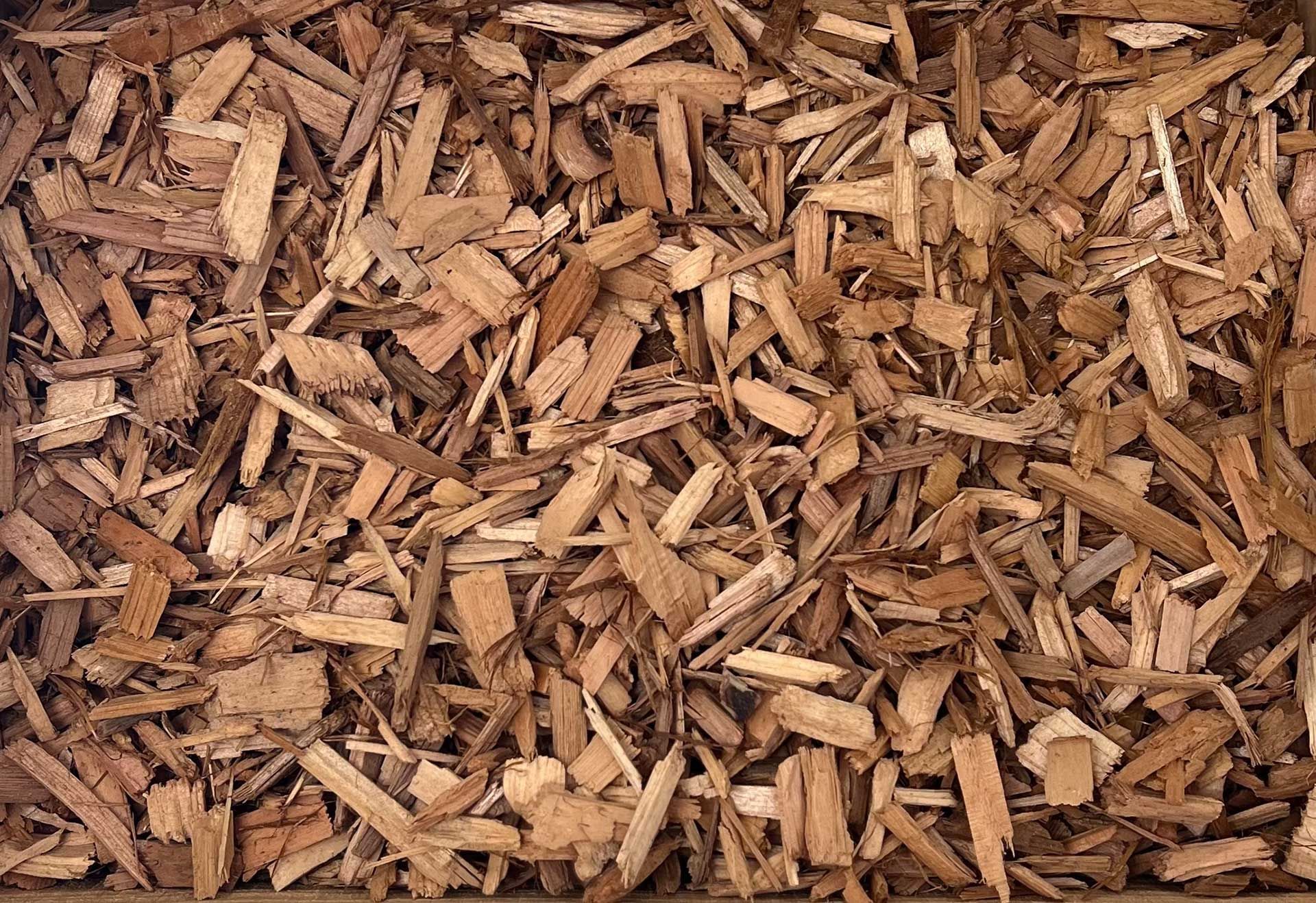 A pile of wood chips is sitting on a table.