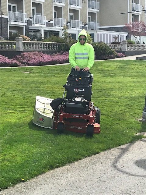 Landscaper cutting lawn