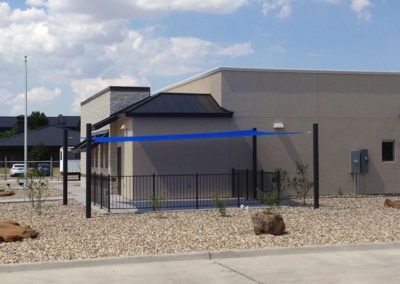A building with a blue awning on the side of it