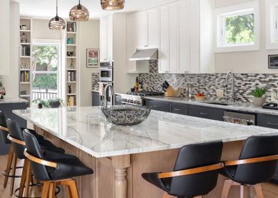 There is a large island in the middle of the kitchen.