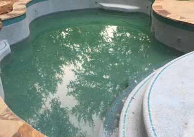 A swimming pool with a lot of water in it.