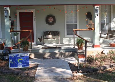 A house decorated for halloween with a sign that says ' justice ' on it