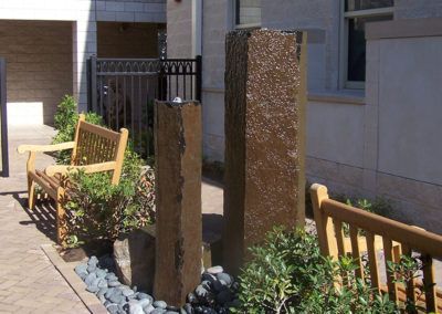 A wooden bench sits in front of a building