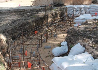 A construction site with a bunch of bags of sand