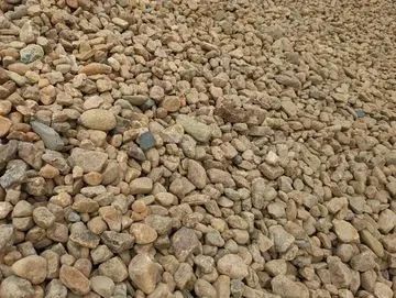 Pile of tan and brown river rock.