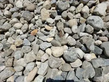 Pile of gray and tan river rock.