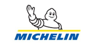 Michelin Man waving, above the blue 