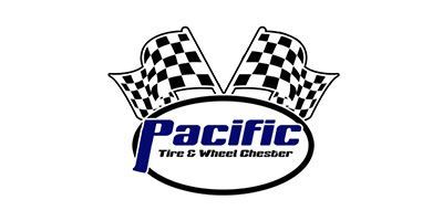 Logo for Pacific Tire & Wheel Chester, black and white checkered flags, blue text on black oval.