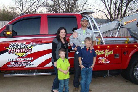 Whitaker's Towing owner with his family
