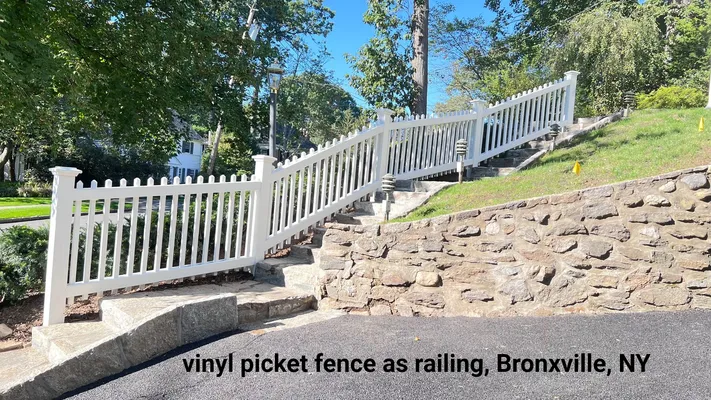 White picket fence as a railing along steps on a hillside in Bronxville, NY.