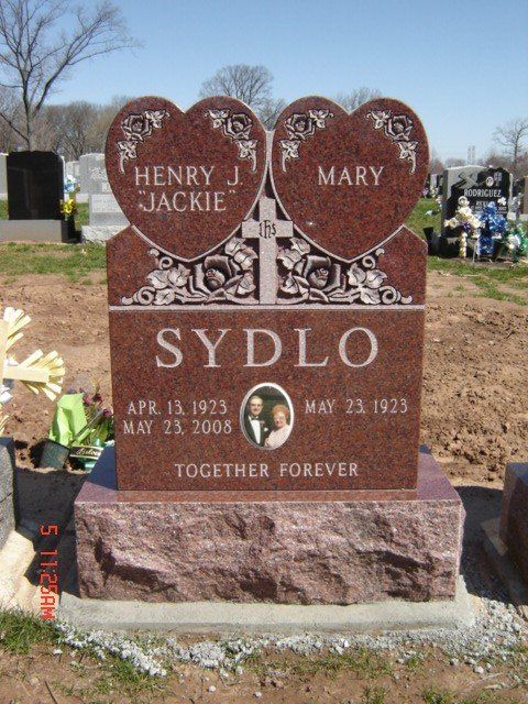 A gravestone for Henry and Mary Sydlo in a cemetery