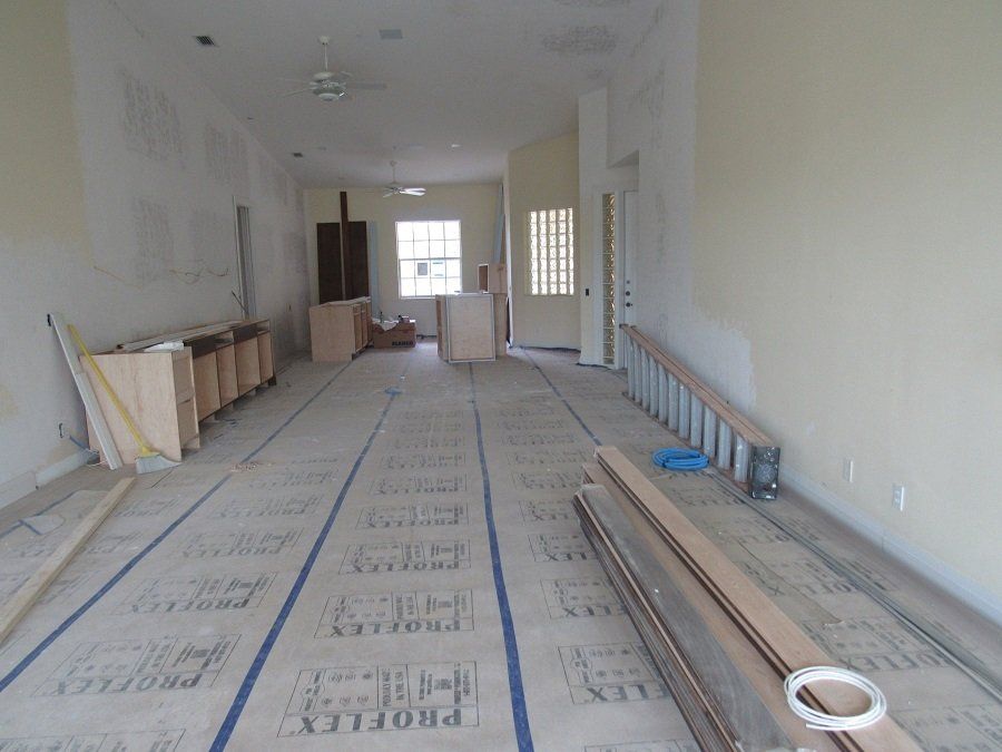 A room that is being remodeled with a floor that says proflex