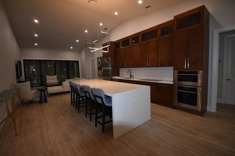 There is a large island in the middle of the kitchen.