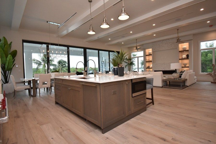 A kitchen with a large island in the middle of it