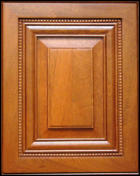 A close up of a wooden door with a black frame