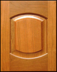 A close up of a wooden door with a rounded corner