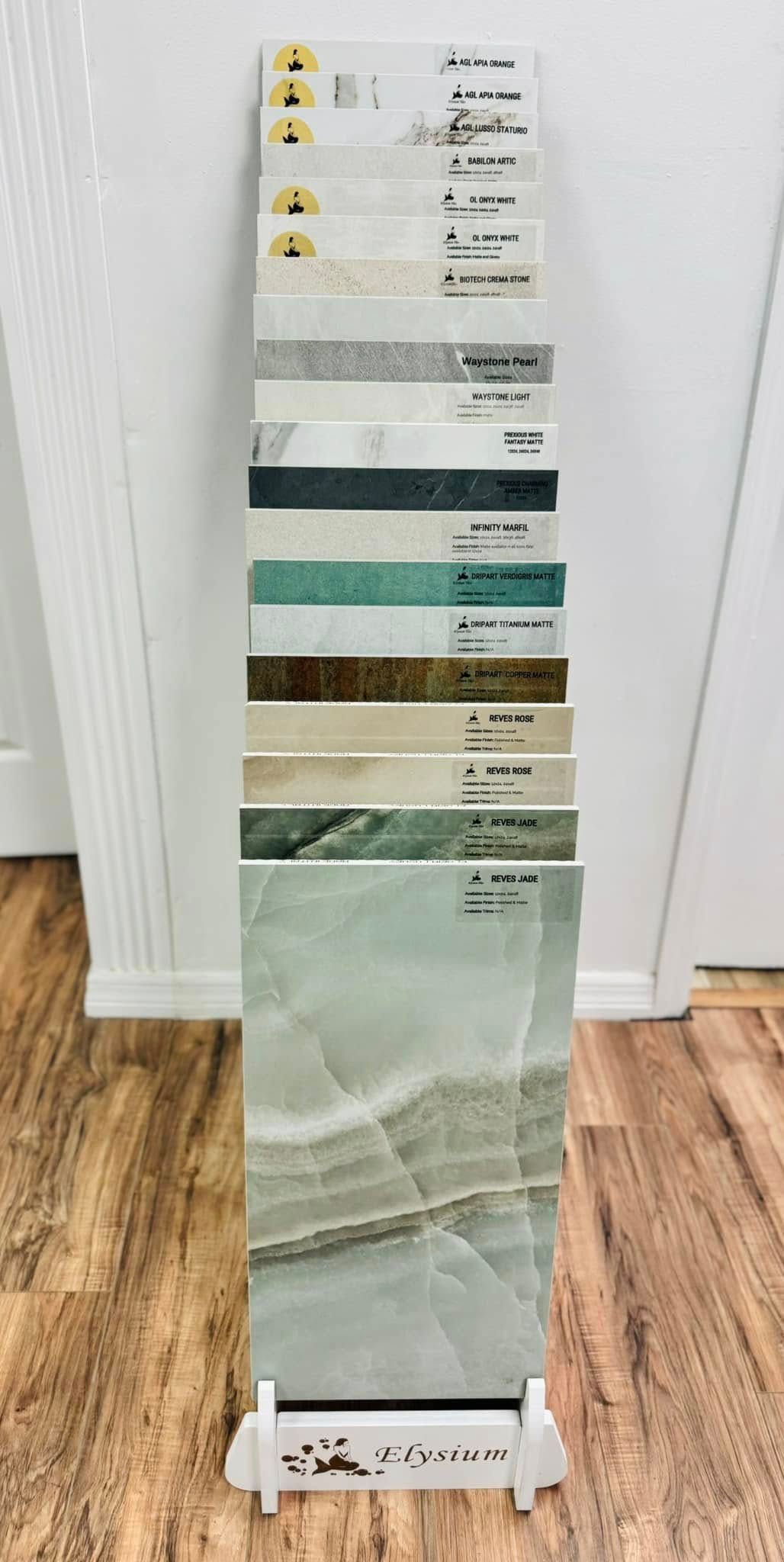 A tile display rack showing various ceramic tile samples in different colors and patterns.