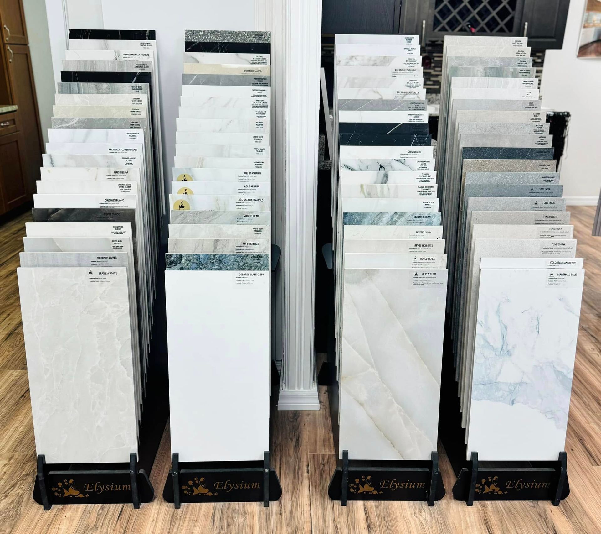 Tile display stands showcasing various floor and wall tile samples.