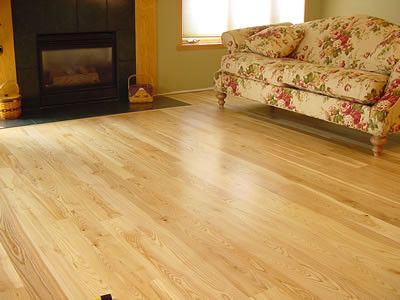 A living room with a couch and a fireplace